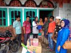 Dinsos Serahkan Bantuan Pada Korban Banjir dan Tanah Longsor