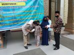 Bupati Hendrajoni Serahkan Santunan  untuk 9.711 Anak Yatim