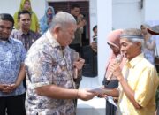 Sekdakab Asahan Serahkan BPJS Kesehatan Gratis dan KIP di 4 Kecamatan