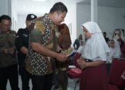 Wabup Asahan Serahkan BPJS Kesehatan Gratis dan KIP di 4 Kecamatan