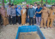 Tim Setmilpres Verifikasi Satyalancana Wira Karya di Amping Parak