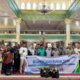 BPJS Ketenagakerjaan Pesisir Selatan menyerahkan bantuan sembako kepada pekerja informal saat Hari Buruh 2026 di Painan.